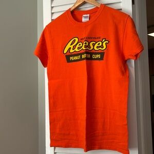 Women’s size S Reese’s orange shirt